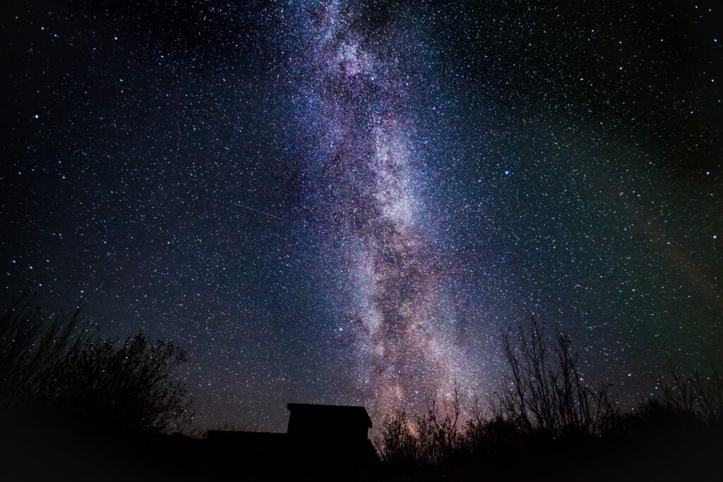 A night sky with the milky way in the background.